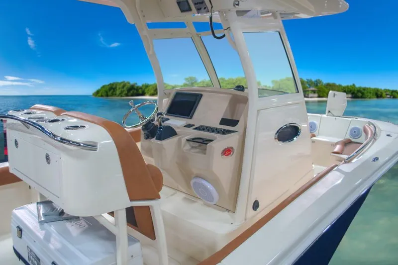 Slide: The Image of 2020 Scout 255 LXF boat with dual Yamaha 150 engines, featuring a comfortable rear bench seat. - 6