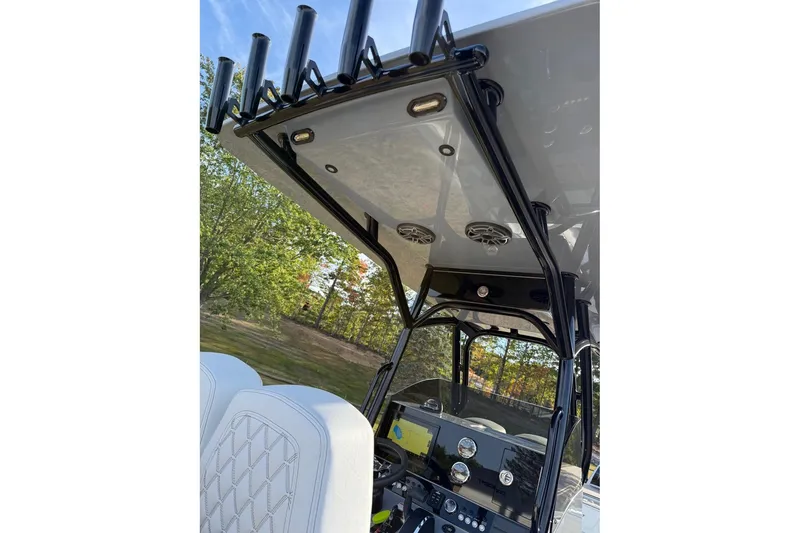 Slide: The Image of 2026 Concept 27' CC boat interior with rod holders and modern dashboard. - 12