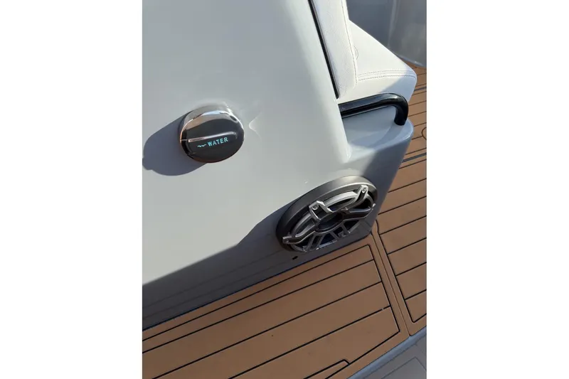Slide: The Image of 2026 Concept 27' CC boat detail with water cap and speaker on deck. - 13