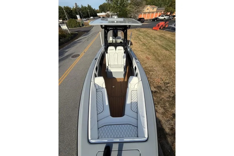 Slide: The Image of 2026 Concept 27' CC boat with sleek design and luxurious seating on display. - 15