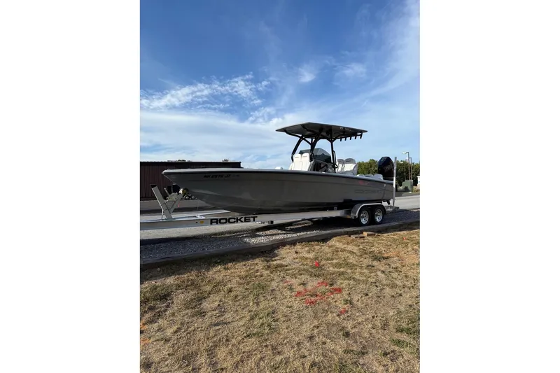 Slide: The Image of 2026 Concept 27' CC boat on trailer under clear blue sky. - 6