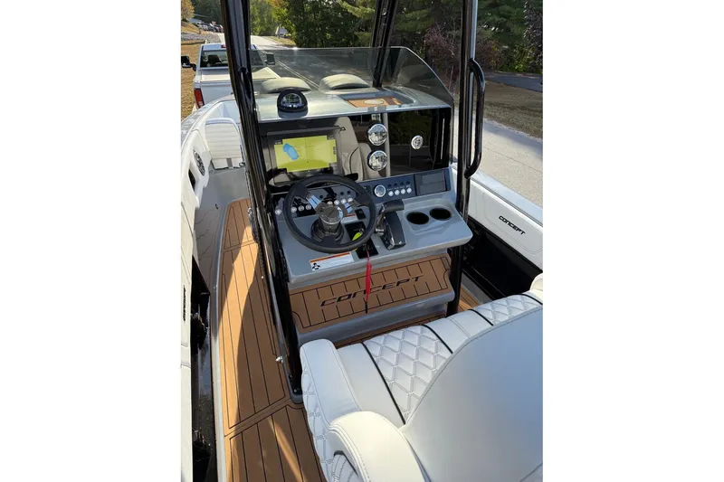 Slide: The Image of 2026 Concept 27' CC boat interior with modern dashboard and steering wheel. - 8