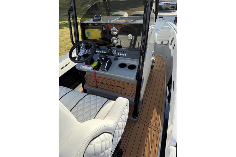 Slide: The Image of 2026 Concept 27' CC boat interior with modern dashboard and luxurious seating. - 9