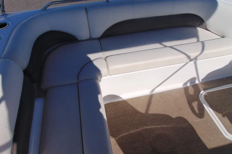 Slide: The Image of Interior seating of a 2013 Hurricane SunDeck Sport 201 IO boat, featuring cushioned upholstery. - 10