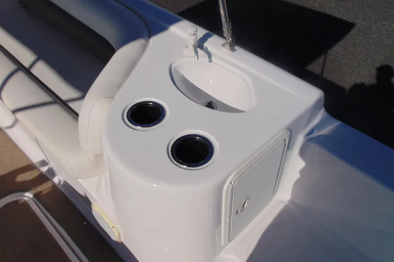 Slide: The Image of 2013 Hurricane SunDeck Sport 201 IO boat interior with cup holders and sink. - 14