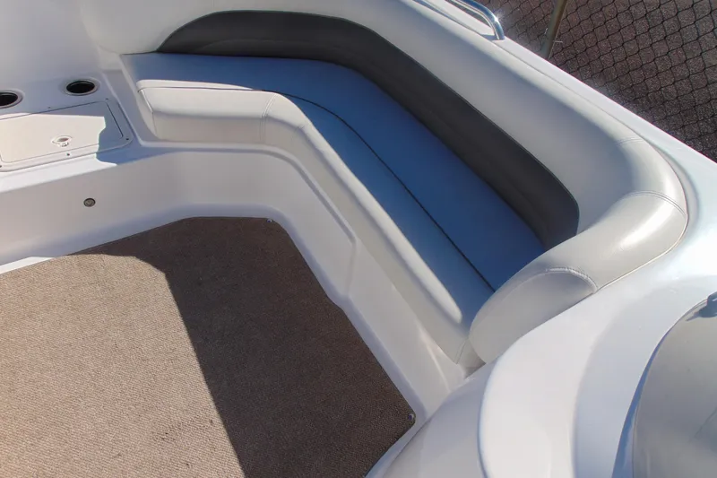 Slide: The Image of 2013 Hurricane SunDeck Sport 201 IO boat interior seating with beige carpet. - 16