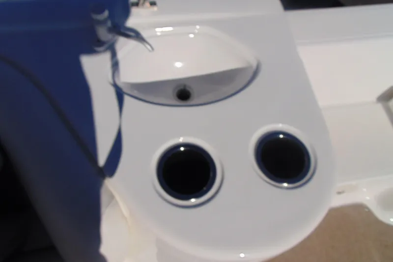Slide: The Image of 2013 Hurricane SunDeck Sport 201 IO boat interior with cup holders and sink. - 18