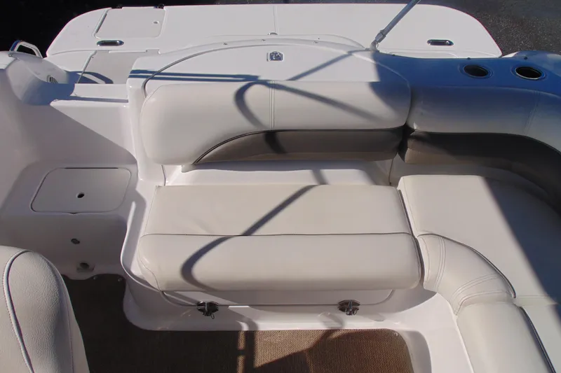 Slide: The Image of 2013 Hurricane SunDeck Sport 201 IO boat interior with white seating and cup holders. - 20