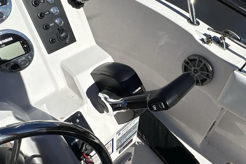 Slide: The Image of 2019 Robalo R180 Center Console boat controls with Yamaha throttle and gauges. - 14