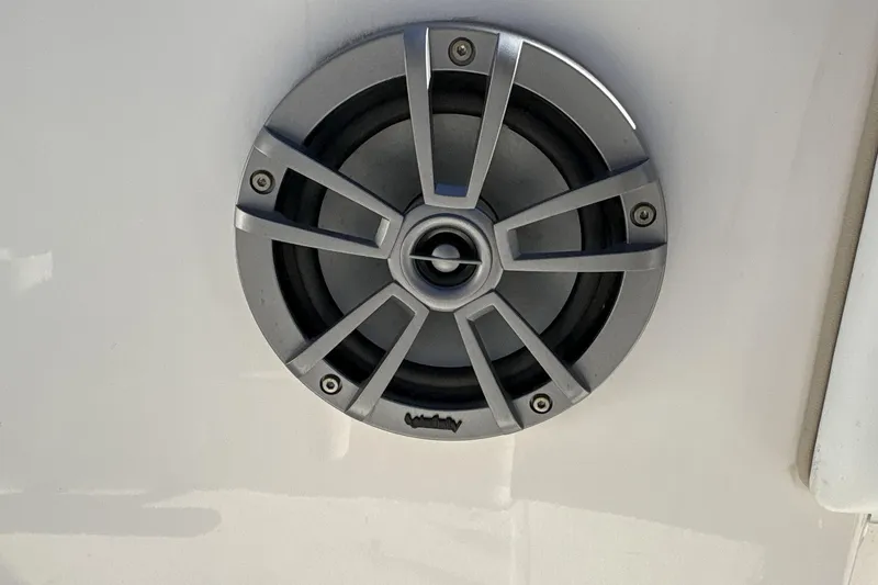 Slide: The Image of Close-up of a speaker on a 2019 Robalo R180 Center Console boat. - 16