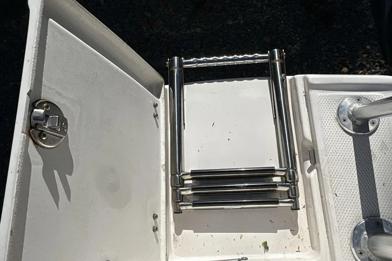 Slide: The Image of Foldable ladder on a 2019 Robalo R180 Center Console boat deck. - 17