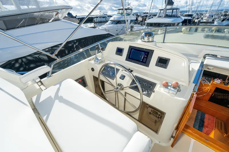 Slide: The Image of Pilothouse of 2001 Fleming 55 yacht with steering wheel and navigation equipment. - 26