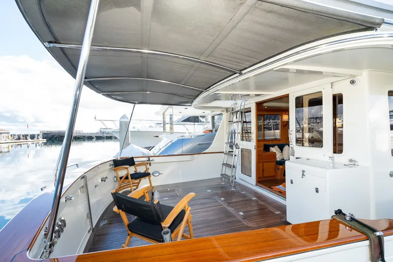 Slide: The Image of Spacious deck of 2001 Fleming 55 Pilothouse yacht with seating and canopy. - 3