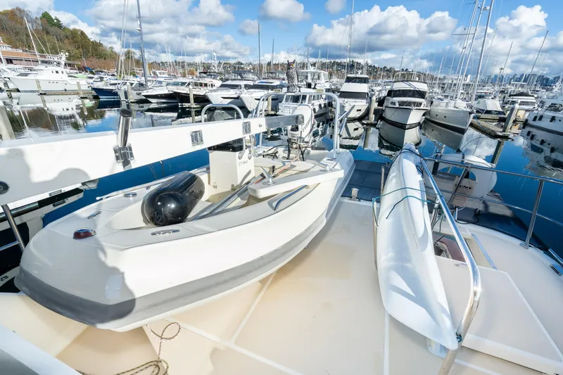 Slide: The Image of 2001 Fleming 55 Pilothouse yacht docked at marina with clear skies and reflections. - 33