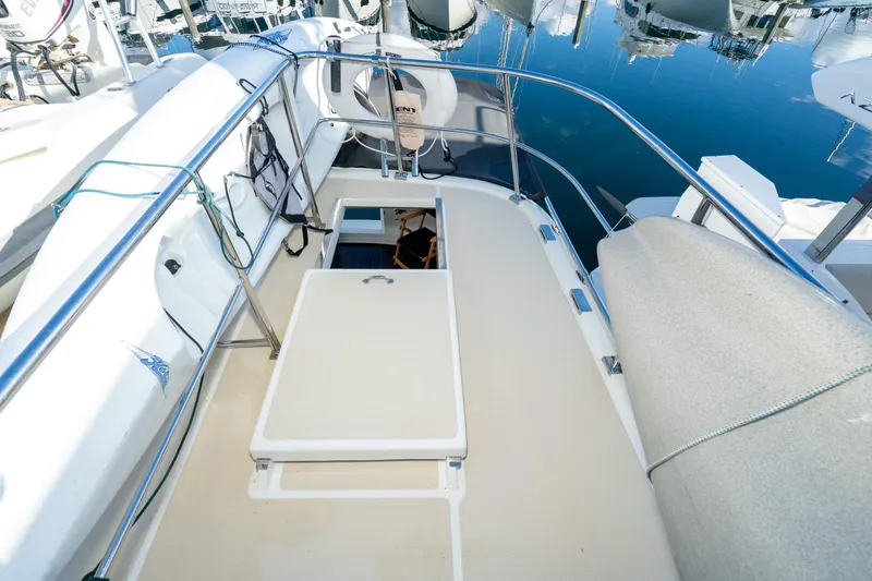 Slide: The Image of 2001 Fleming 55 Pilothouse yacht deck with open hatch and railing. - 36