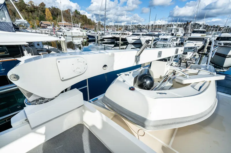 Slide: The Image of Fleming 55 Pilothouse 2001 yacht at marina, featuring deck and davit system. - 37