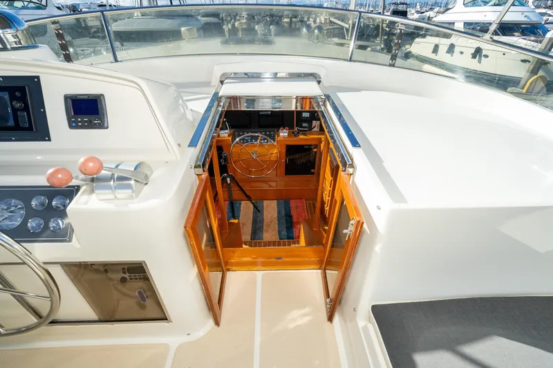 Slide: The Image of Pilothouse of 2001 Fleming 55 yacht with open hatch and control panel. - 40