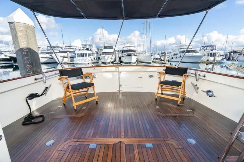 Slide: The Image of Spacious deck of 2001 Fleming 55 Pilothouse yacht with marina view. - 5