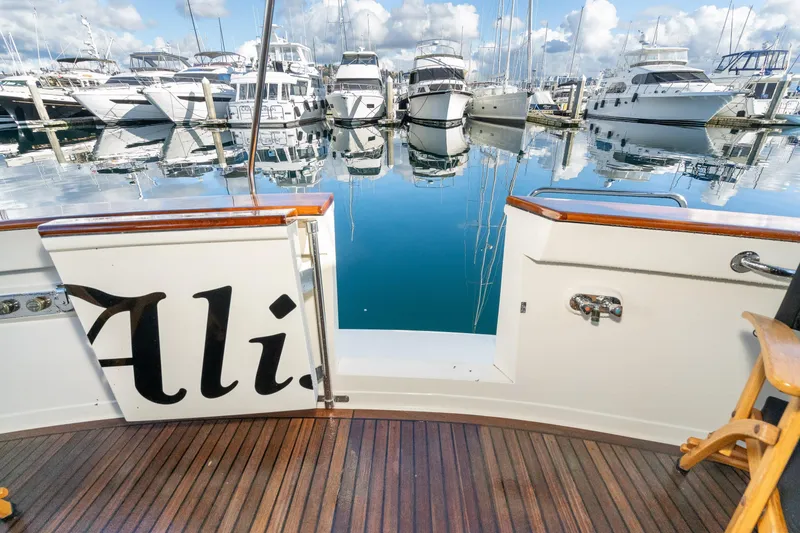 Slide: The Image of Fleming 55 Pilothouse yacht deck with marina view, 2001 model. - 53