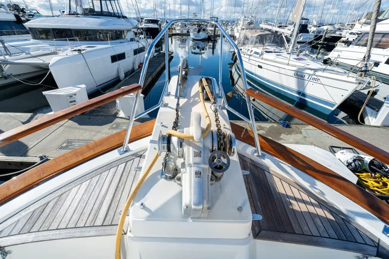 Slide: The Image of Bow view of 2001 Fleming 55 Pilothouse yacht docked at marina. - 60