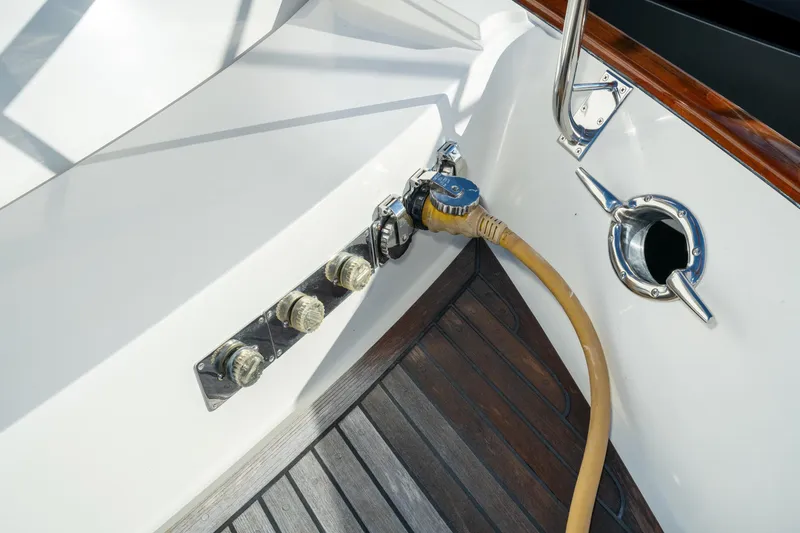 Slide: The Image of Fleming 55 Pilothouse 2001 yacht deck with hose and fittings. - 63