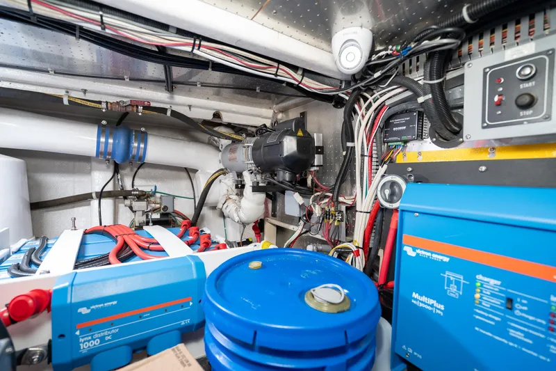 Slide: The Image of Engine room of 2001 Fleming 55 Pilothouse with electrical systems and wiring. - 83