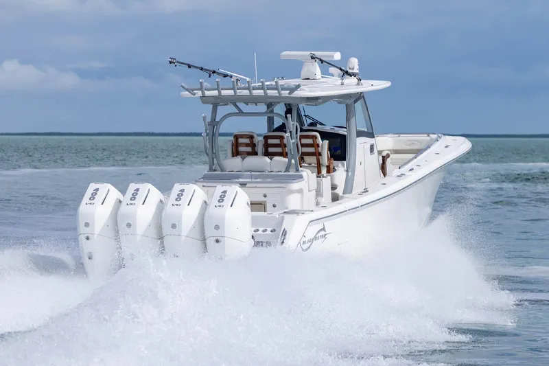 Slide: The Image of 2024 Blackwater 43 Sportfish boat cruising on open water with powerful engines. - 34