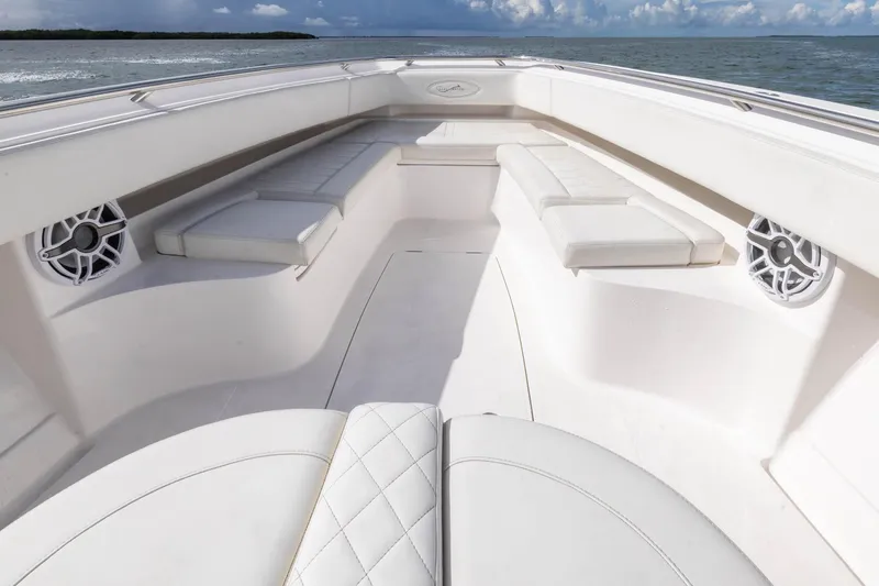 Slide: The Image of 2024 Blackwater 43 Sportfish boat interior with white seating and ocean view. - 40