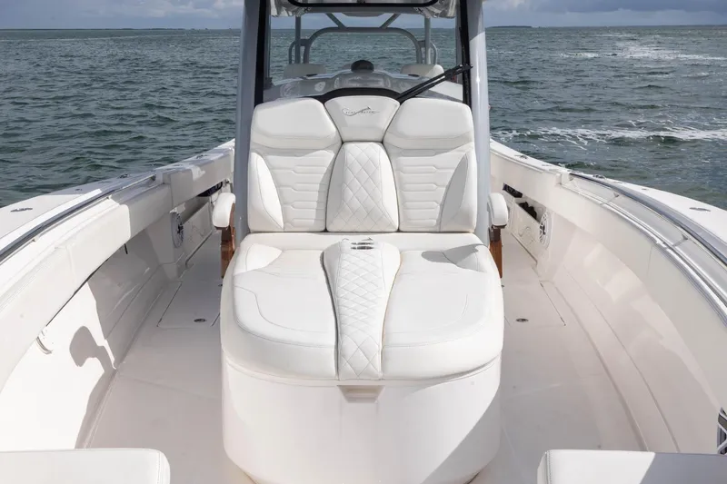 Slide: The Image of 2024 Blackwater 43 Sportfish boat with luxurious white seating on open water. - 41