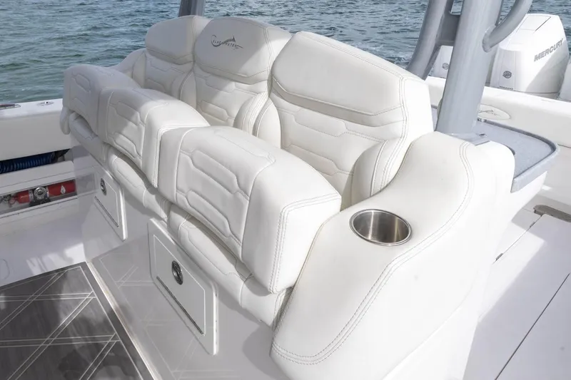 Slide: The Image of Luxurious seating on 2024 Blackwater 43 Sportfish boat with cup holder, white upholstery. - 55