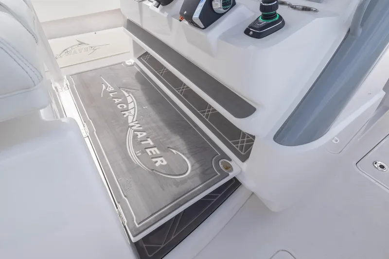Slide: The Image of 2024 Blackwater 43 Sportfish boat interior with branded flooring and control panel. - 56