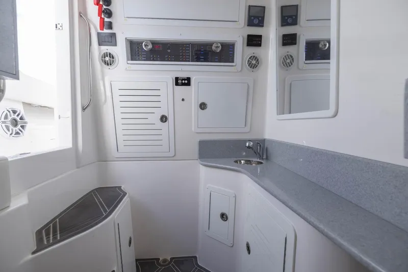 Slide: The Image of 2024 Blackwater 43 Sportfish interior with sleek cabinetry and modern control panels. - 62