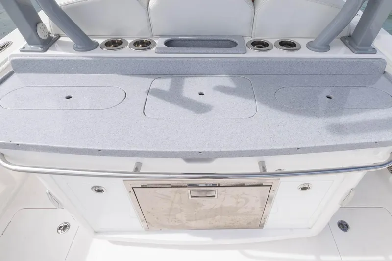 Slide: The Image of 2024 Blackwater 43 Sportfish boat deck with storage compartments and cup holders. - 65