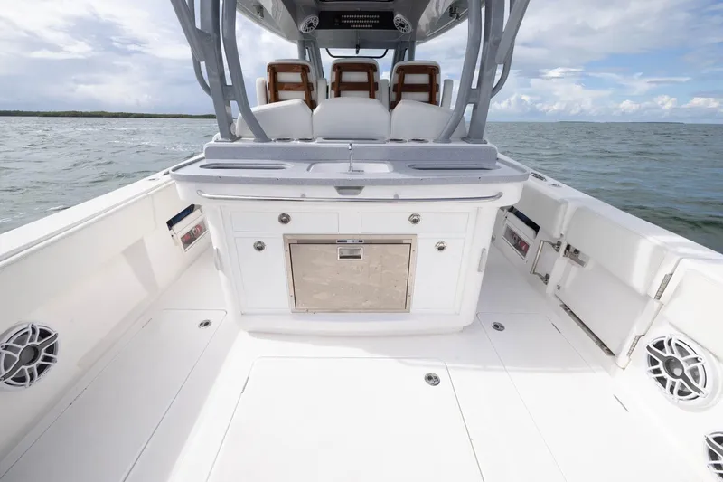 Slide: The Image of 2024 Blackwater 43 Sportfish boat deck with seating and storage, ocean view. - 66