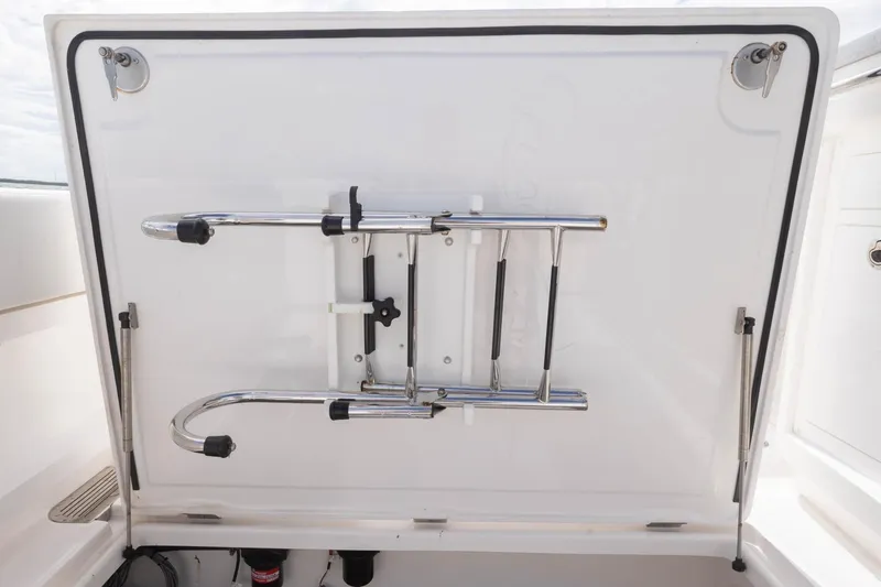 Slide: The Image of 2024 Blackwater 43 Sportfish boat ladder storage compartment with stainless steel fittings. - 68