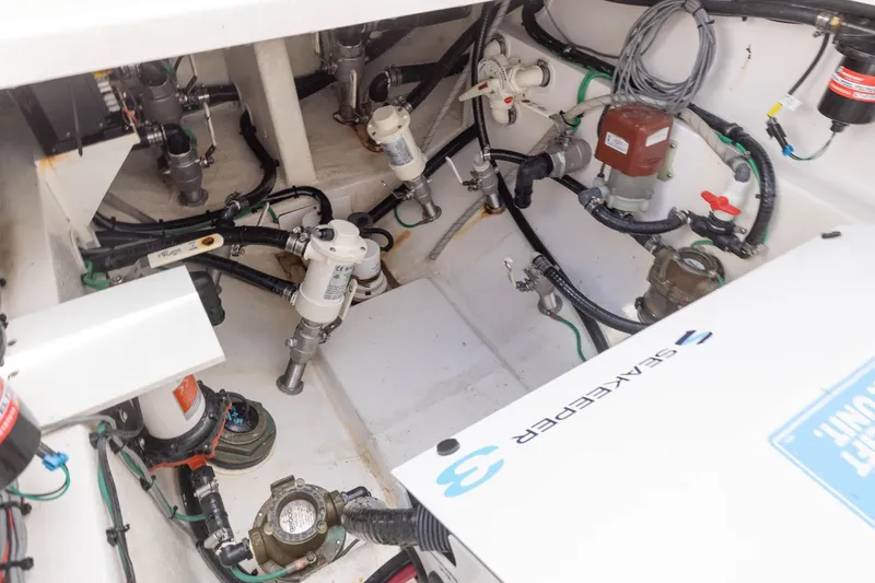 Slide: The Image of Engine compartment of 2024 Blackwater 43 Sportfish, showcasing mechanical components and wiring. - 69
