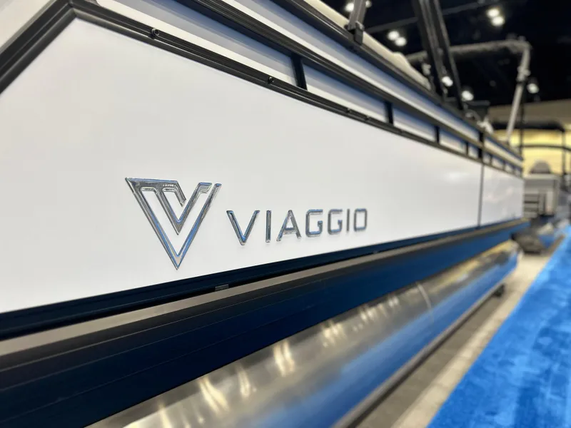 Slide: The Image of 2025 Viaggio V22U boat side view with logo, displayed indoors. - 18