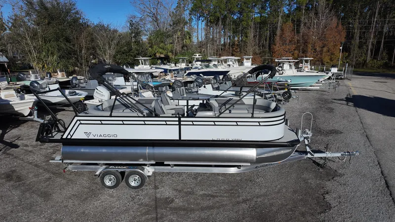 Slide: The Image of 2025 Viaggio V22U pontoon boat on trailer in outdoor lot. - 3