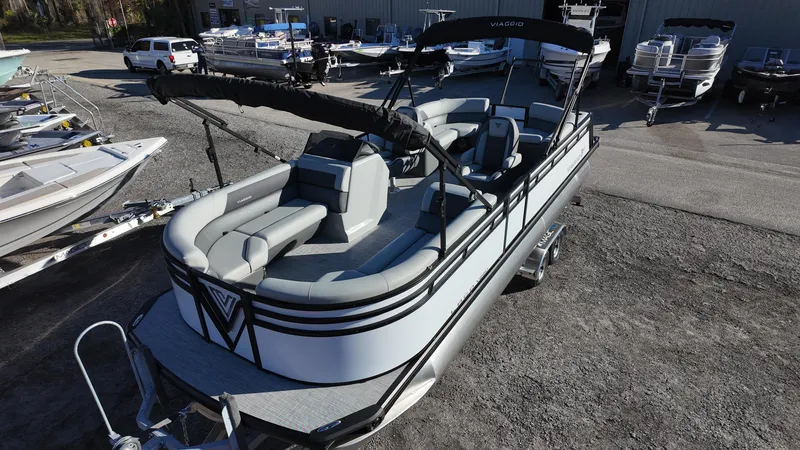 Slide: The Image of 2025 Viaggio V22U pontoon boat with sleek design and spacious seating. - 7