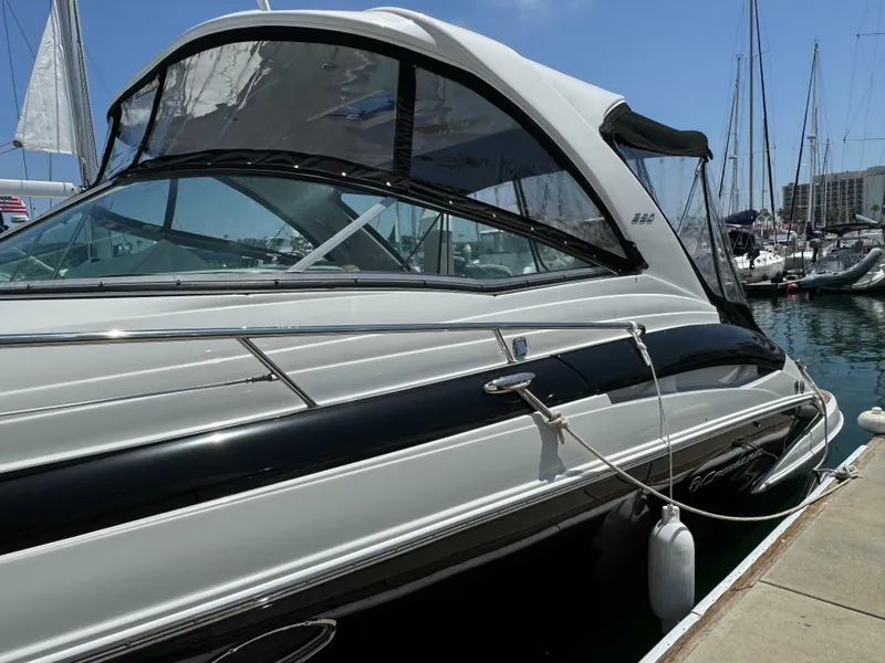 Slide: The Image of 2018 Crownline 350 SY yacht docked at marina, featuring sleek design and modern amenities. - 10