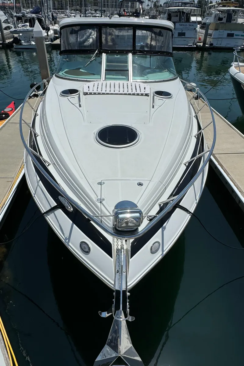 Slide: The Image of 2018 Crownline 350 SY yacht docked in marina, front view. - 17