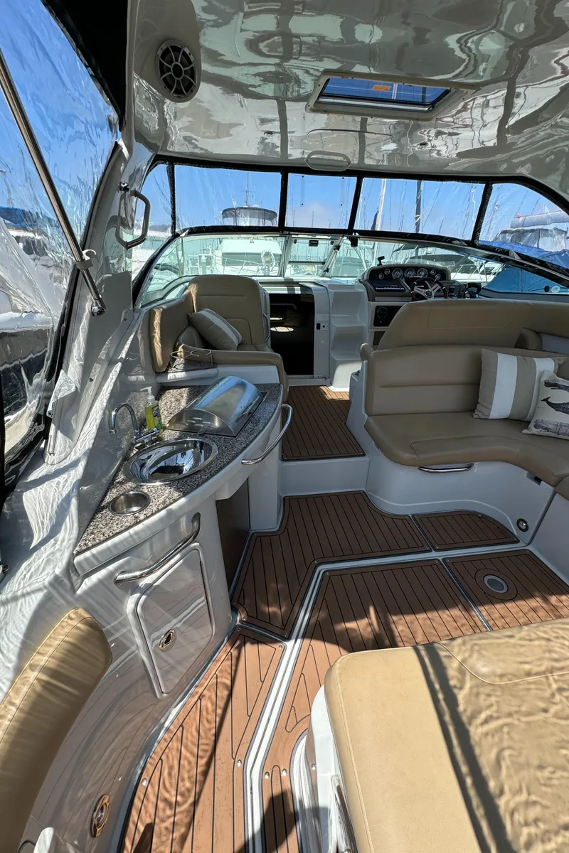Slide: The Image of 2018 Crownline 350 SY yacht interior with luxurious seating and modern amenities. - 24