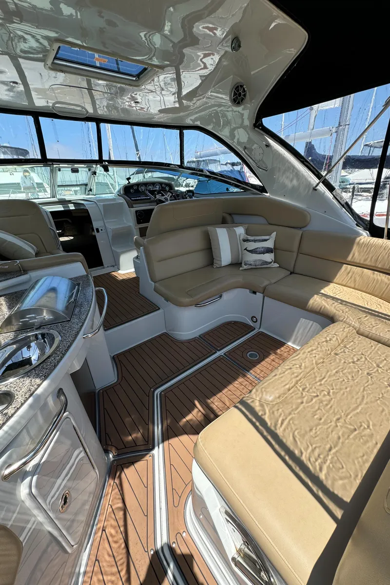 Slide: The Image of 2018 Crownline 350 SY yacht interior with luxurious seating and modern amenities. - 28