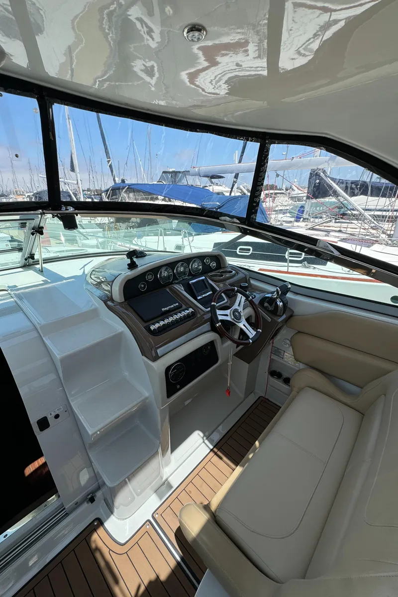 Slide: The Image of 2018 Crownline 350 SY yacht cockpit with modern controls and leather seating. - 35