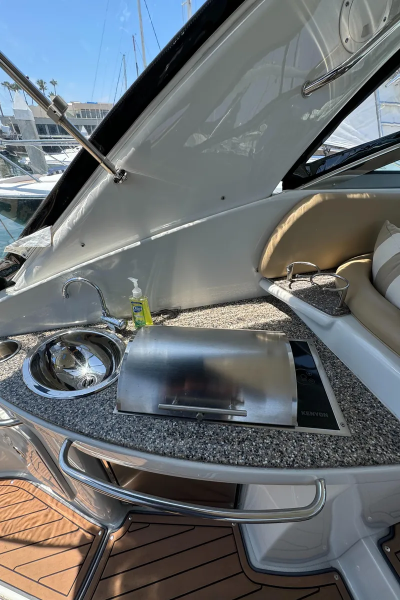 Slide: The Image of 2018 Crownline 350 SY yacht with sleek outdoor kitchenette and sink. - 38