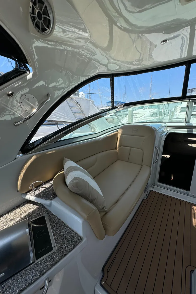 Slide: The Image of 2018 Crownline 350 SY yacht interior with beige seating and modern design. - 39