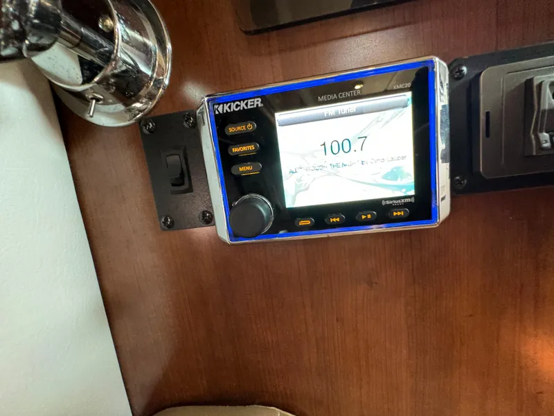 Slide: The Image of Kicker media center in 2018 Crownline 350 SY boat interior. - 48