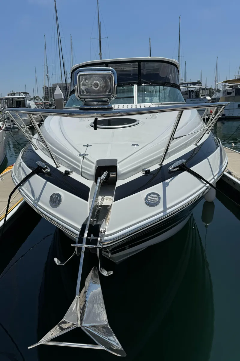 Slide: The Image of 2018 Crownline 350 SY yacht docked in marina, front view with anchor. - 5