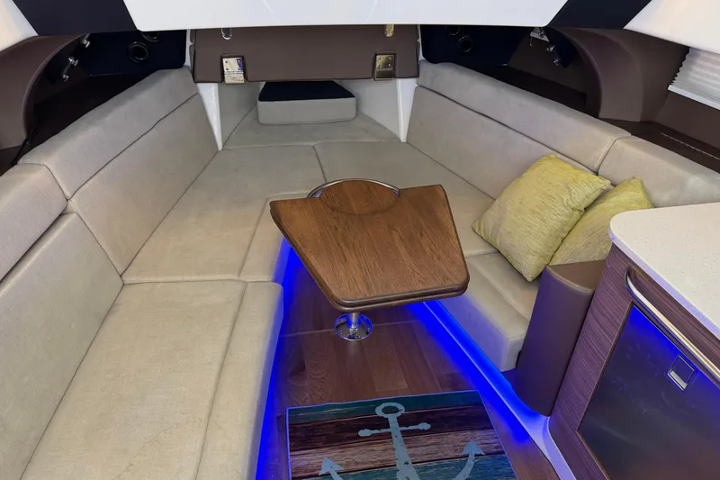 Slide: The Image of Luxurious interior of 2020 Boston Whaler 420 Outrage with cozy seating and ambient lighting. - 11
