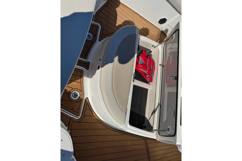 Slide: The Image of 2020 Boston Whaler 420 Outrage boat deck with storage compartment and life jacket. - 20
